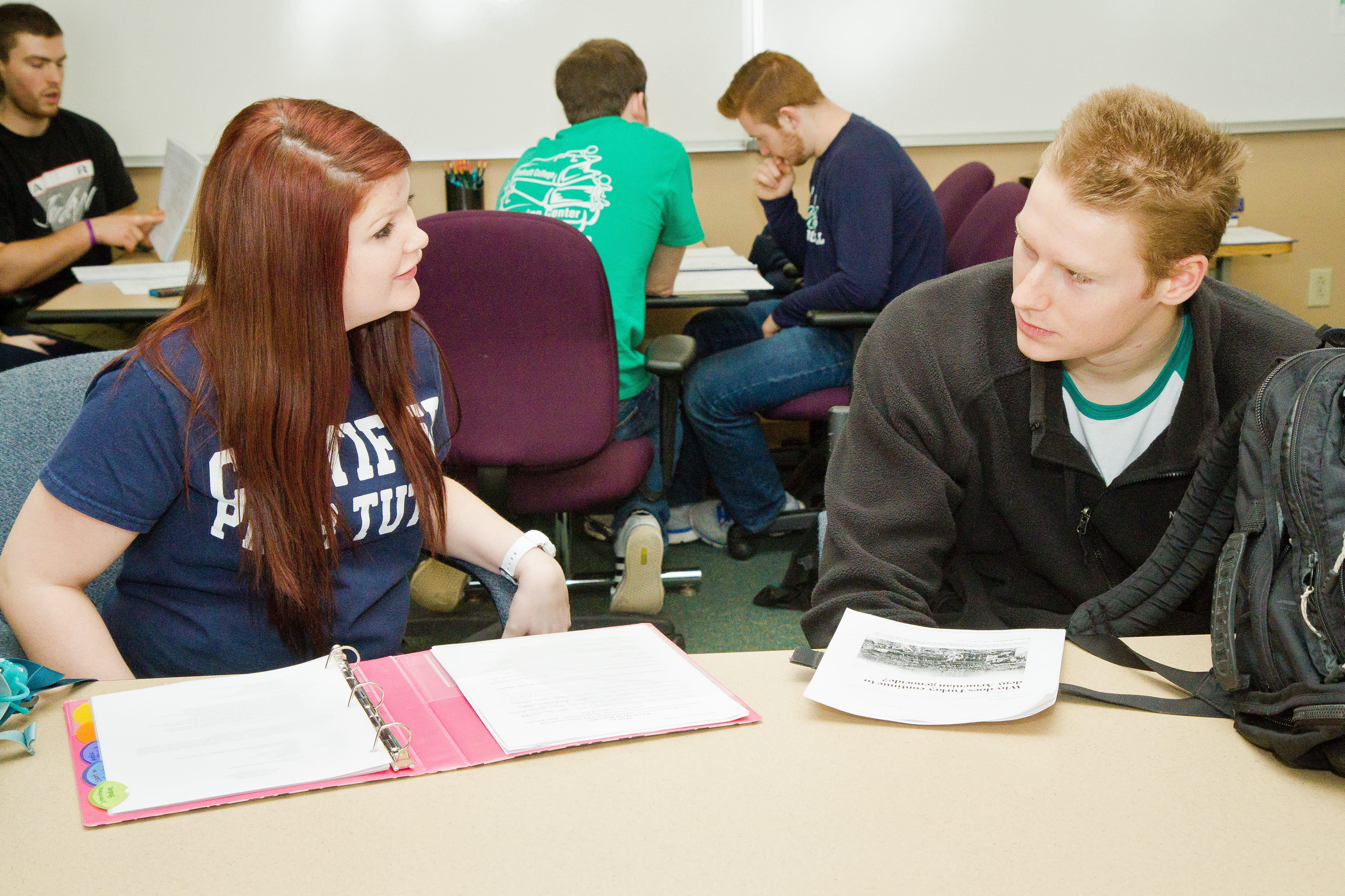 Peer Tutor and student review materials in Tutoring Center.