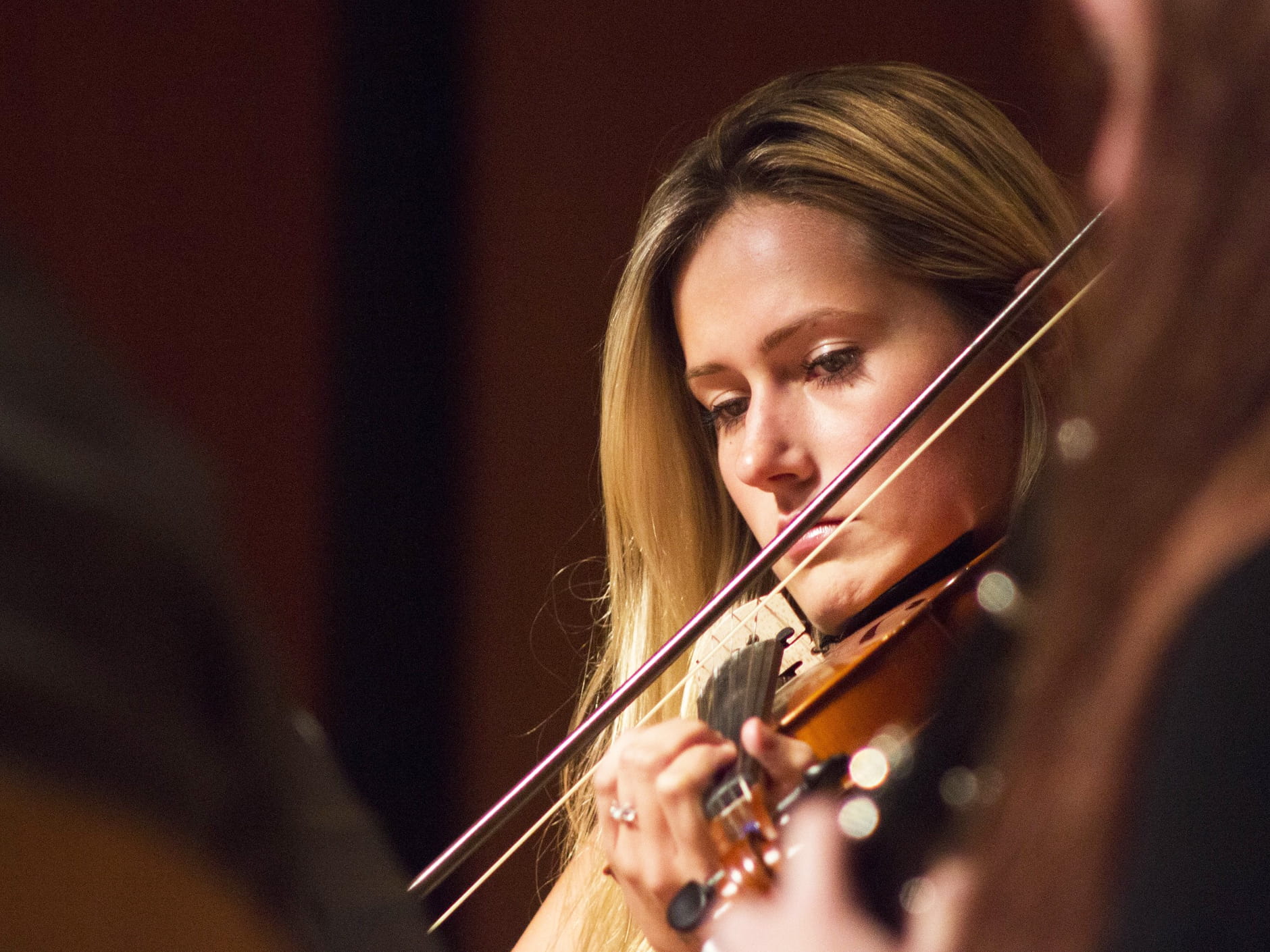 girl playing stringed instrument