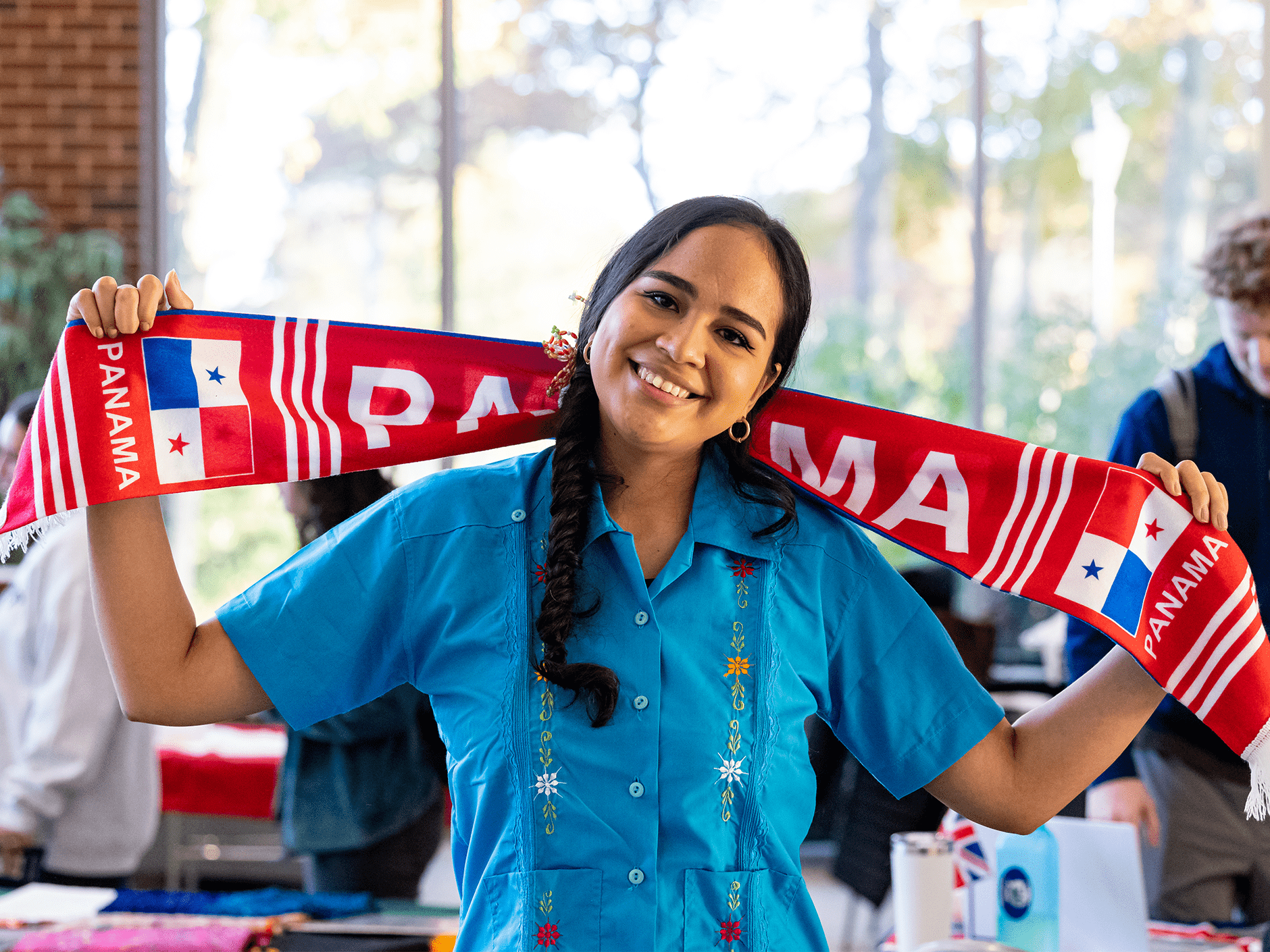 global village banner - panama student with flag