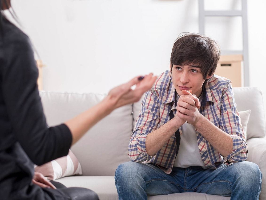male student on couch