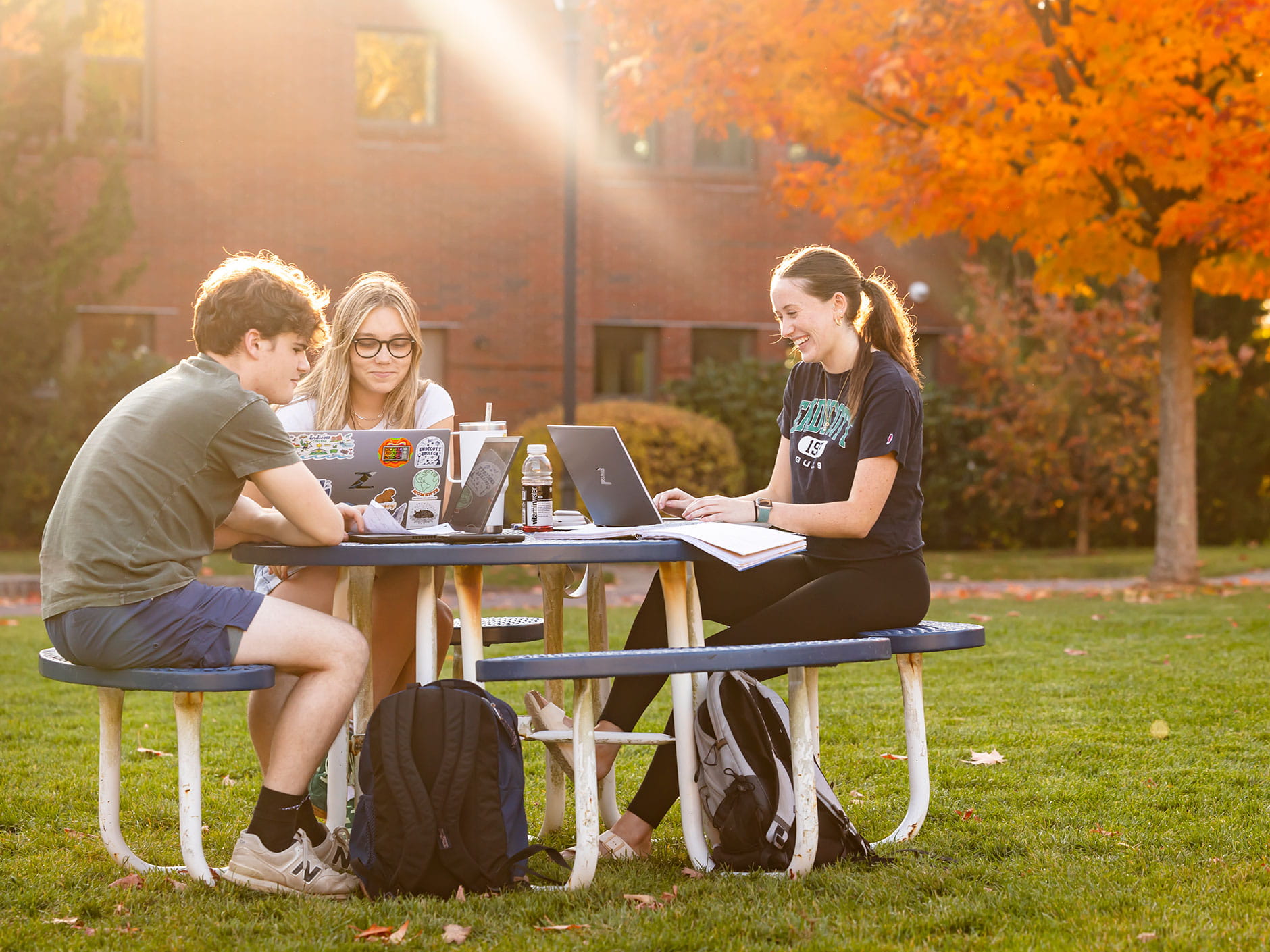 Students sitting on benches at Endicott College