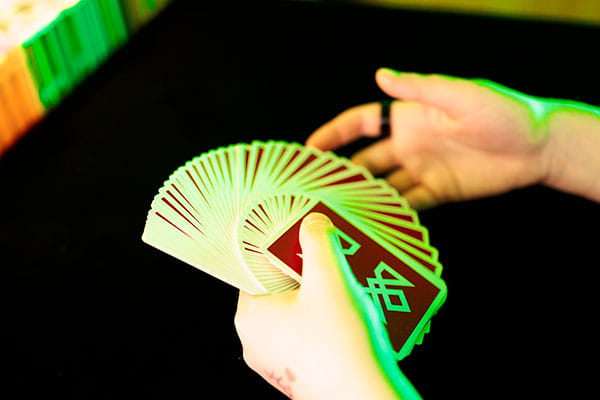 Hands holding cards