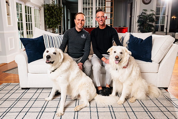 Bryan Cain with his husband Colby and their dogs
