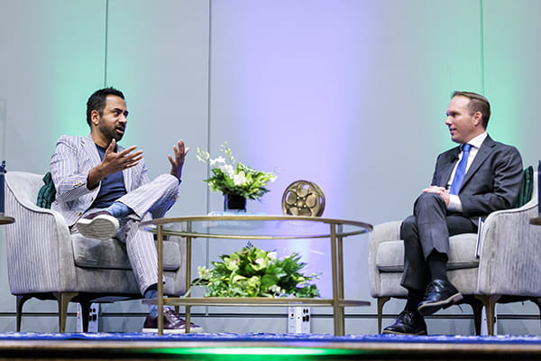 Kal Penn on stage at Endicott College with Bryan Cain