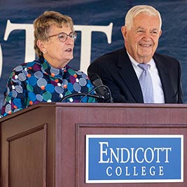 male and female spearers at podium