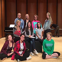 the drama club posing for a photo