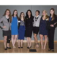 a group of women standing together for a photo