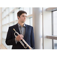 a man holding a trumpet