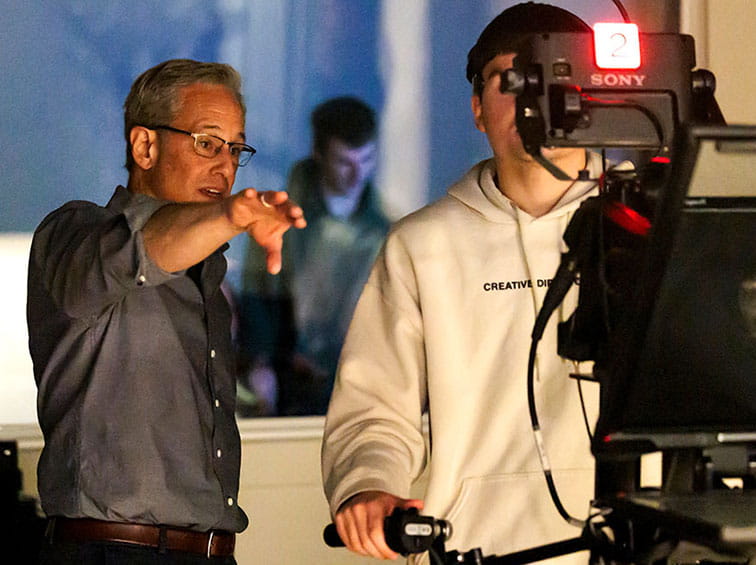 Dan Frank working with a student