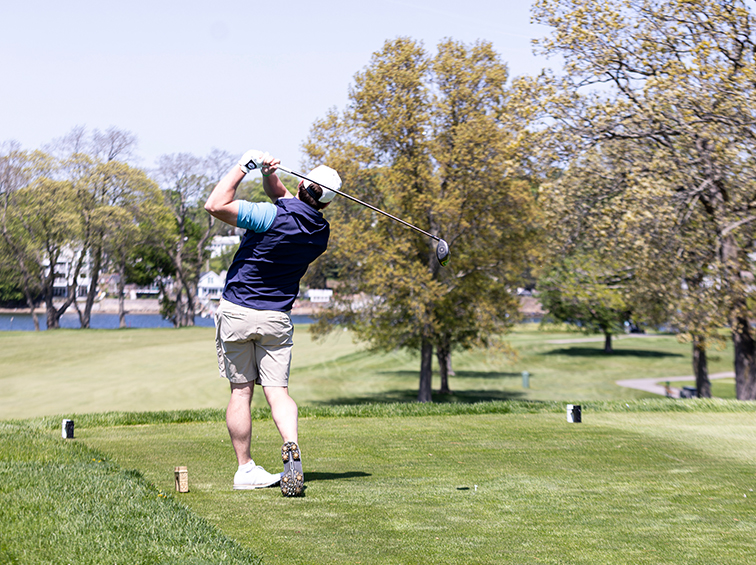 A person golfing